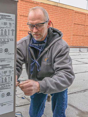 Sensible Solutions Owner rewiring an HVAC unit